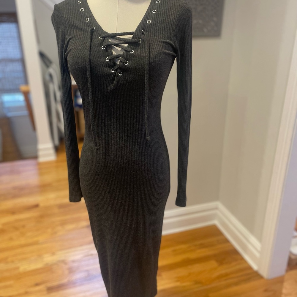Bar 111 grey polyester/spandex. It's fitted and up to calf. Beautiful neck line
